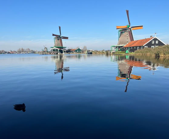 Maaike your local tourguide  wearing Dutch wooden shoes. Windmill, Tulips, Cheese, Zaanse Schans, Keukenhof, Volendam, Marken, Alkmaar.