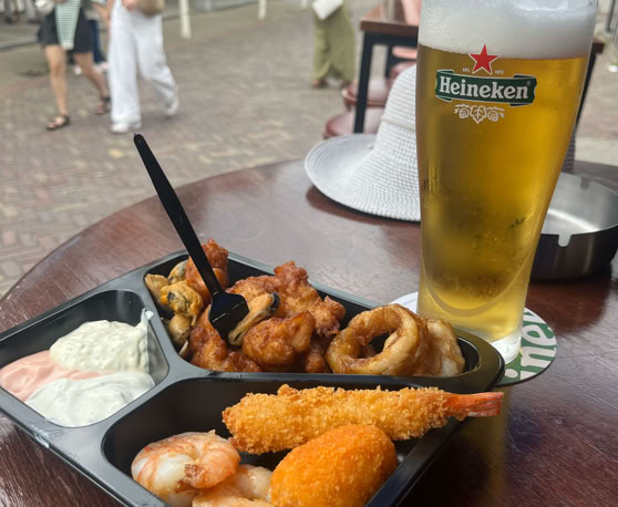 Maaike your local tourguide  wearing Dutch wooden shoes. Windmill, Tulips, Cheese, Zaanse Schans, Keukenhof, Volendam, Marken, Alkmaar.