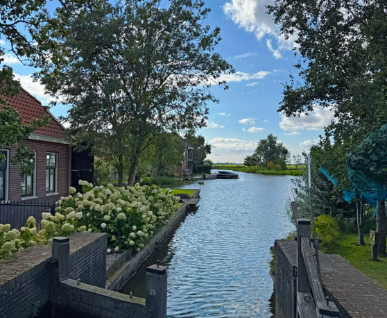 Maaike your local tourguide  wearing Dutch wooden shoes. Windmill, Tulips, Cheese, Zaanse Schans, Keukenhof, Volendam, Marken, Alkmaar.
