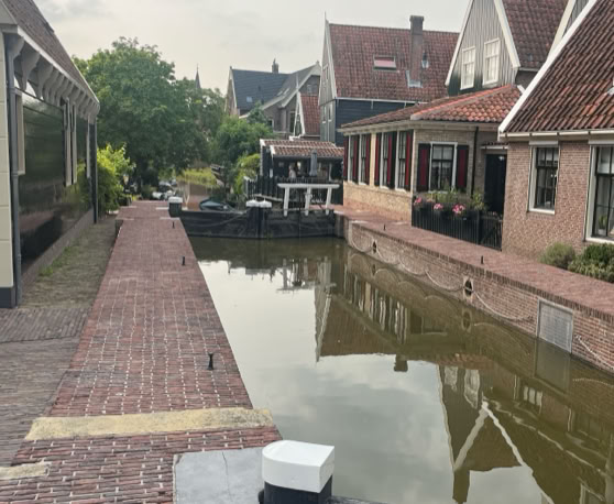 Maaike your local tourguide  wearing Dutch wooden shoes. Windmill, Tulips, Cheese, Zaanse Schans, Keukenhof, Volendam, Marken, Alkmaar.