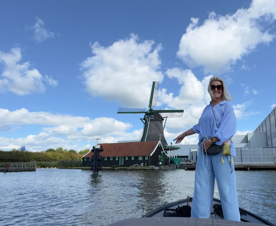 Maaike your local tourguide  wearing Dutch wooden shoes. Windmill, Tulips, Cheese, Zaanse Schans, Keukenhof, Volendam, Marken, Alkmaar.