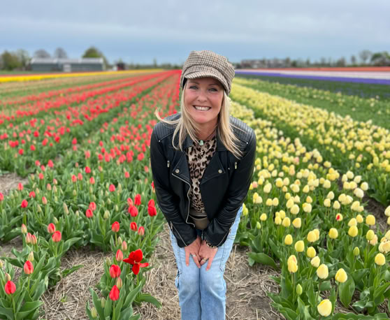 Maaike your local tourguide  wearing Dutch wooden shoes. Windmill, Tulips, Cheese, Zaanse Schans, Keukenhof, Volendam, Marken, Alkmaar.