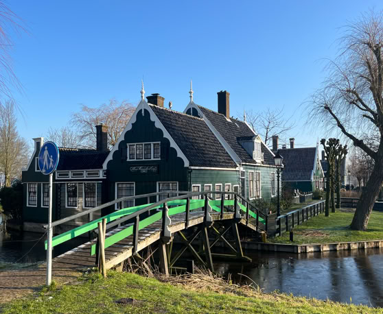Maaike your local tourguide  wearing Dutch wooden shoes. Windmill, Tulips, Cheese, Zaanse Schans, Keukenhof, Volendam, Marken, Alkmaar.