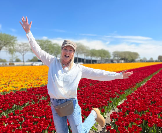 Maaike your local tourguide  wearing Dutch wooden shoes. Windmill, Tulips, Cheese, Zaanse Schans, Keukenhof, Volendam, Marken, Alkmaar.