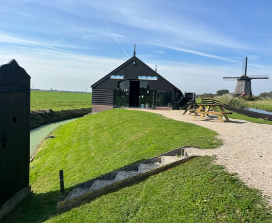 Maaike your local tourguide  wearing Dutch wooden shoes. Windmill, Tulips, Cheese, Zaanse Schans, Keukenhof, Volendam, Marken, Alkmaar.