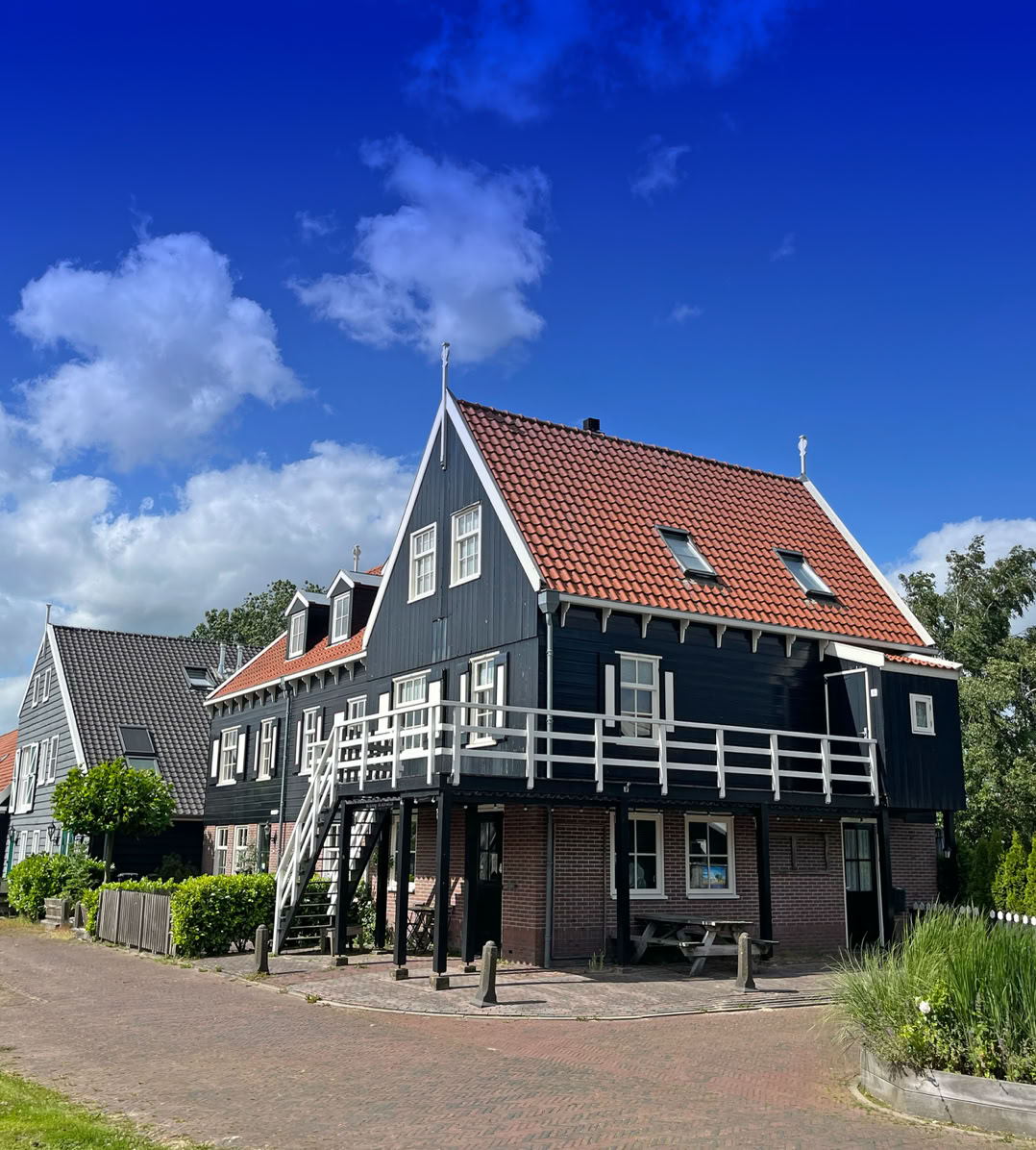 Maaike your local tourguide  wearing Dutch wooden shoes. Windmill, Tulips, Cheese, Zaanse Schans, Keukenhof, Volendam, Marken, Alkmaar.