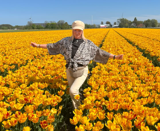 Maaike your local tourguide  wearing Dutch wooden shoes. Windmill, Tulips, Cheese, Zaanse Schans, Keukenhof, Volendam, Marken, Alkmaar.