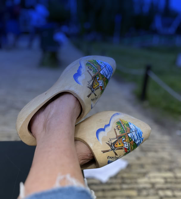 Maaike your local tourguide  wearing Dutch wooden shoes. Windmill, Tulips, Cheese, Zaanse Schans, Keukenhof, Volendam, Marken, Alkmaar.