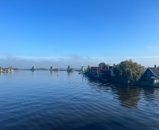 Maaike your local tourguide  wearing Dutch wooden shoes. Windmill, Tulips, Cheese, Zaanse Schans, Keukenhof, Volendam, Marken, Alkmaar.