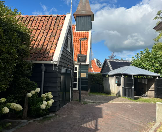 Maaike your local tourguide  wearing Dutch wooden shoes. Windmill, Tulips, Cheese, Zaanse Schans, Keukenhof, Volendam, Marken, Alkmaar.