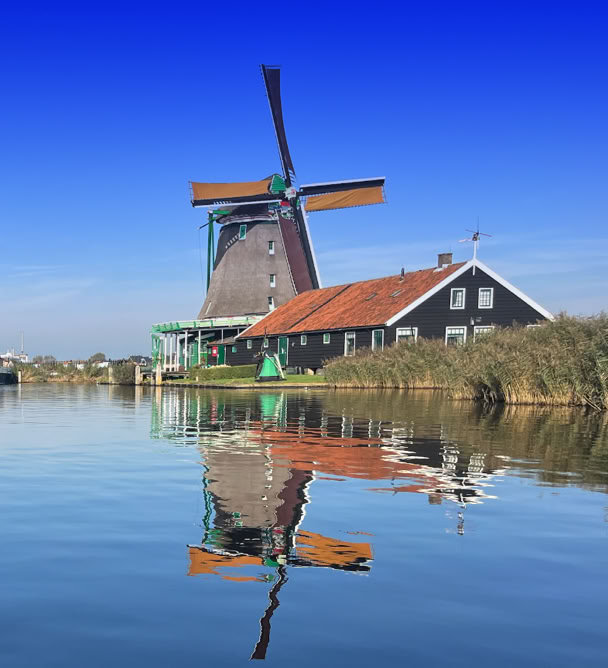 Maaike your local tourguide  wearing Dutch wooden shoes. Windmill, Tulips, Cheese, Zaanse Schans, Keukenhof, Volendam, Marken, Alkmaar.