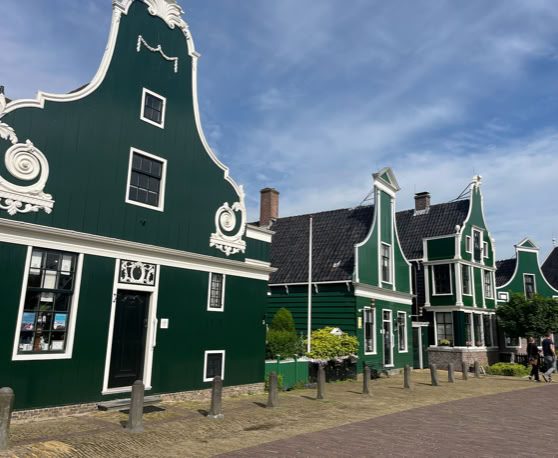 Maaike your local tourguide  wearing Dutch wooden shoes. Windmill, Tulips, Cheese, Zaanse Schans, Keukenhof, Volendam, Marken, Alkmaar.