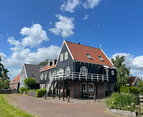Maaike your local tourguide  wearing Dutch wooden shoes. Windmill, Tulips, Cheese, Zaanse Schans, Keukenhof, Volendam, Marken, Alkmaar.