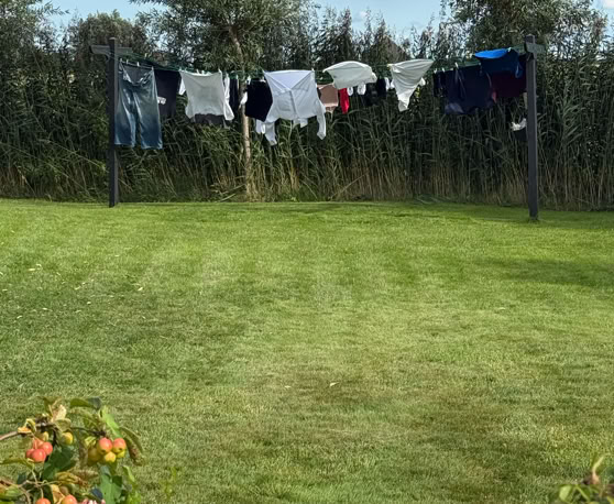 Maaike your local tourguide  wearing Dutch wooden shoes. Windmill, Tulips, Cheese, Zaanse Schans, Keukenhof, Volendam, Marken, Alkmaar.