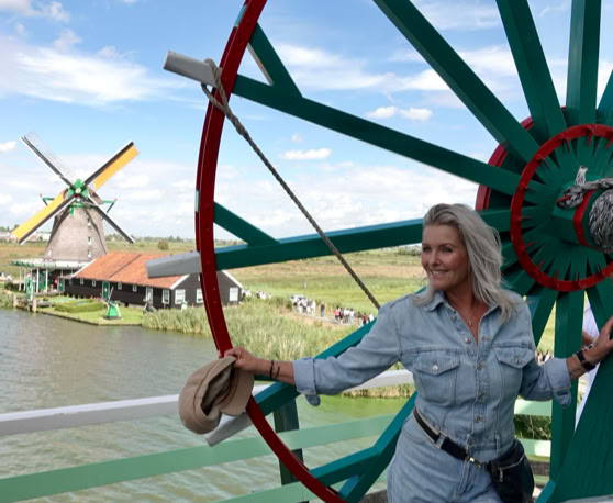 Maaike your local tourguide  wearing Dutch wooden shoes. Windmill, Tulips, Cheese, Zaanse Schans, Keukenhof, Volendam, Marken, Alkmaar.