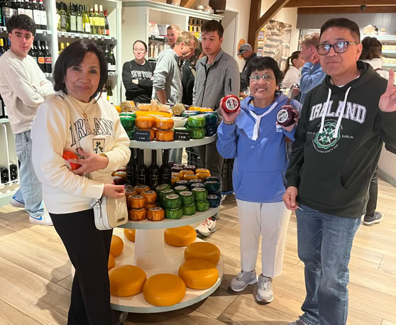 Maaike your local tourguide  wearing Dutch wooden shoes. Windmill, Tulips, Cheese, Zaanse Schans, Keukenhof, Volendam, Marken, Alkmaar.