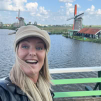 Maaike your local tourguide  wearing Dutch wooden shoes. Windmill, Tulips, Cheese, Zaanse Schans, Keukenhof, Volendam, Marken, Alkmaar.