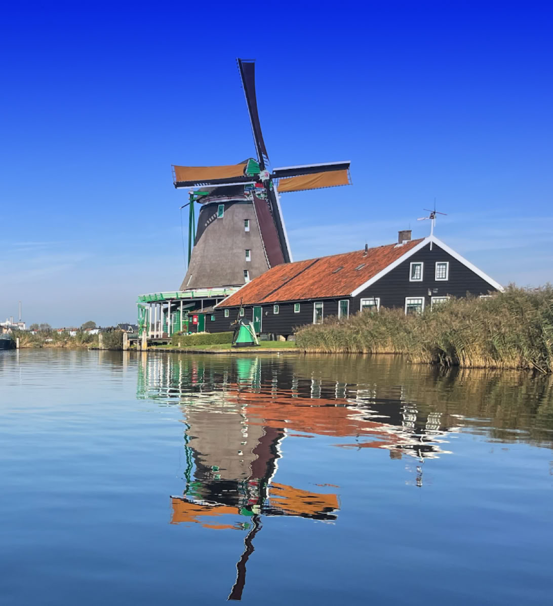 Maaike your local tourguide  wearing Dutch wooden shoes. Windmill, Tulips, Cheese, Zaanse Schans, Keukenhof, Volendam, Marken, Alkmaar.