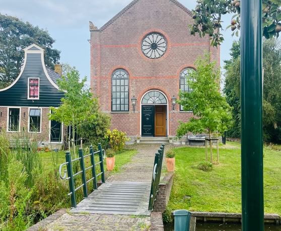 Maaike your local tourguide  wearing Dutch wooden shoes. Windmill, Tulips, Cheese, Zaanse Schans, Keukenhof, Volendam, Marken, Alkmaar.