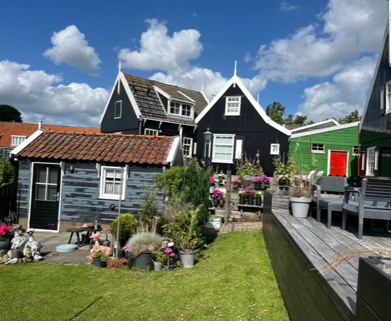Maaike your local tourguide  wearing Dutch wooden shoes. Windmill, Tulips, Cheese, Zaanse Schans, Keukenhof, Volendam, Marken, Alkmaar.